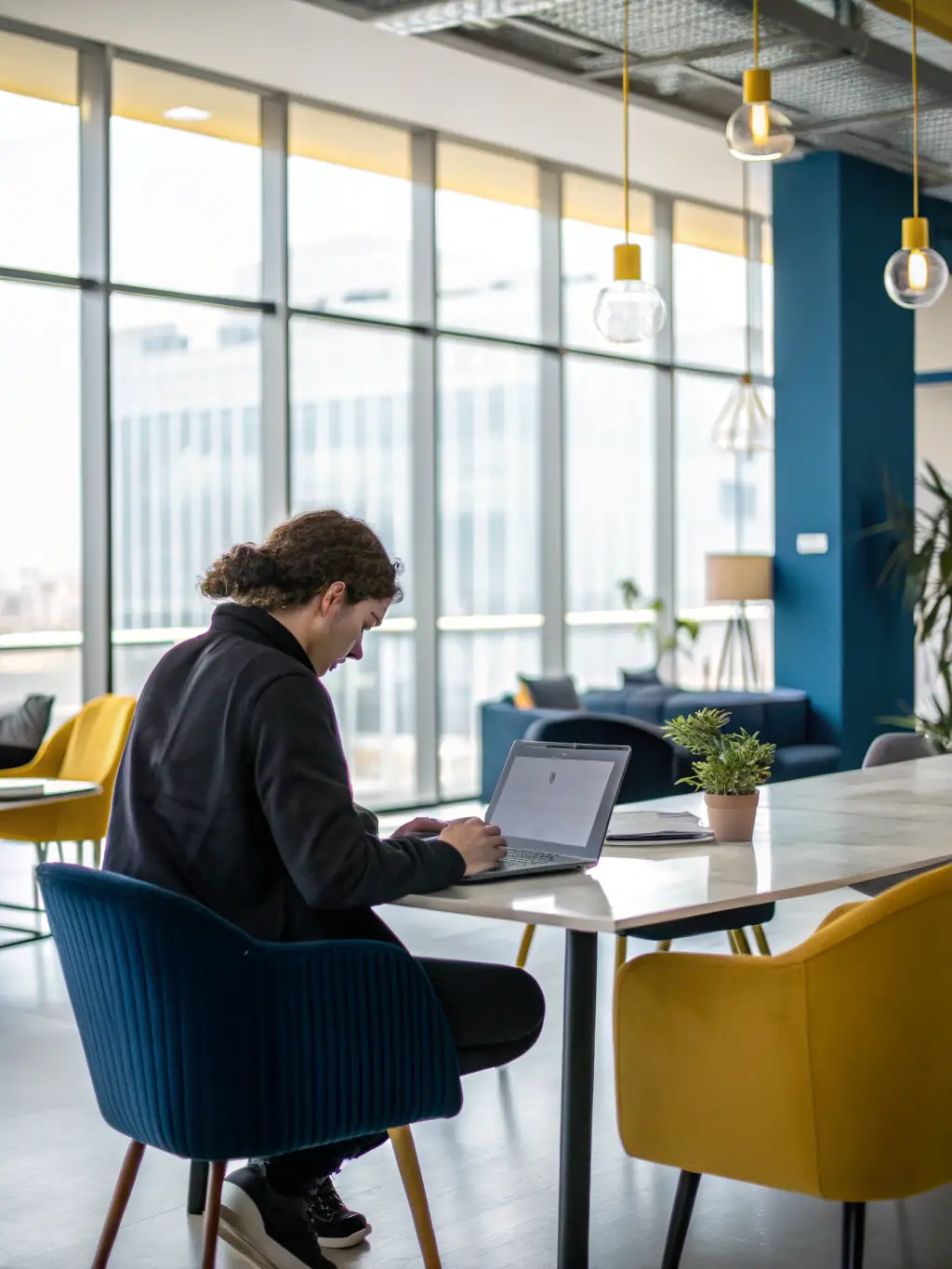 A professional office setting with a person typing on a computer, representing typing and copy services offered by WRIA.